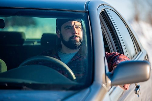 MIKAELA MACKENZIE / WINNIPEG FREE PRESS

Brett Parkin, who hasnt driven for SkipTheDishes for three weeks because of gas prices, poses for a portrait with his car in Winnipeg on Wednesday, March 9, 2022. For Gabby story.
Winnipeg Free Press 2022.