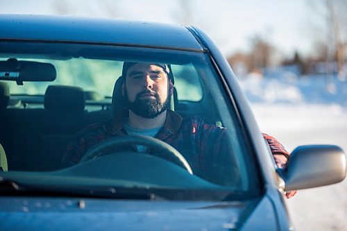 MIKAELA MACKENZIE / WINNIPEG FREE PRESS

Brett Parkin, who hasnt driven for SkipTheDishes for three weeks because of gas prices, poses for a portrait with his car in Winnipeg on Wednesday, March 9, 2022. For Gabby story.
Winnipeg Free Press 2022.