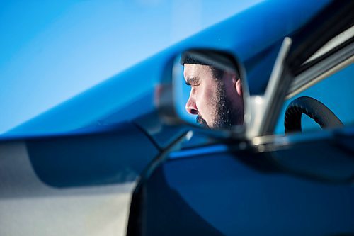 MIKAELA MACKENZIE / WINNIPEG FREE PRESS

Brett Parkin, who hasnt driven for SkipTheDishes for three weeks because of gas prices, poses for a portrait with his car in Winnipeg on Wednesday, March 9, 2022. For Gabby story.
Winnipeg Free Press 2022.