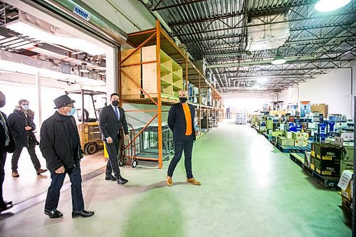 MIKAELA MACKENZIE / WINNIPEG FREE PRESS

Federal Public Safety Minister Marco Mendicino (centre) gets a tour of the warehouse, which houses liquor that has sat there for a couple of years, with Emerson Duty Free owner Simon Resch (right) and co-owner/dad Michael Resch during the minister's visit to Emerson on Thursday, March 10, 2022. For Gabby story.
Winnipeg Free Press 2022.