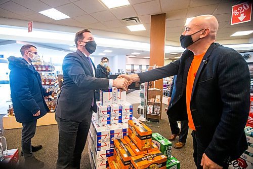 MIKAELA MACKENZIE / WINNIPEG FREE PRESS

Federal Public Safety Minister Marco Mendicino (left) shakes Emerson Duty Free owner Simon Resch's hand on a visit to Emerson on Thursday, March 10, 2022. For Gabby story.
Winnipeg Free Press 2022.