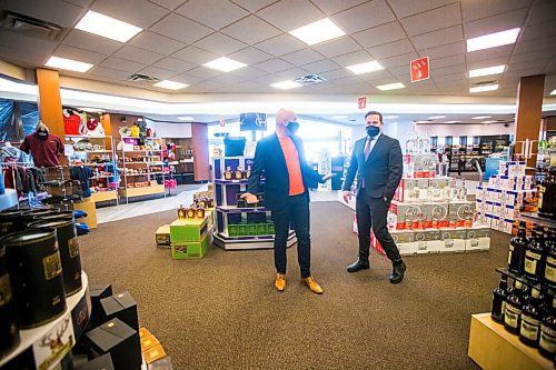 MIKAELA MACKENZIE / WINNIPEG FREE PRESS

Emerson Duty Free owner Simon Resch (left) gives Federal Public Safety Minister Marco Mendicino a tour of the store during the minister's visit to Emerson on Thursday, March 10, 2022. For Gabby story.
Winnipeg Free Press 2022.
