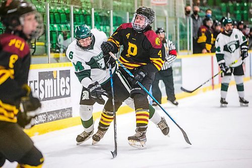 MIKAELA MACKENZIE / WINNIPEG FREE PRESS

Vincent Massey Trojan George Robert Kovall (6) and Portage Trojan Alex Vandeynze (4) collide during a Manitoba AAAA high school boys hockey championship game in Selkirk on Friday, March 11, 2022. Standup.
Winnipeg Free Press 2022.