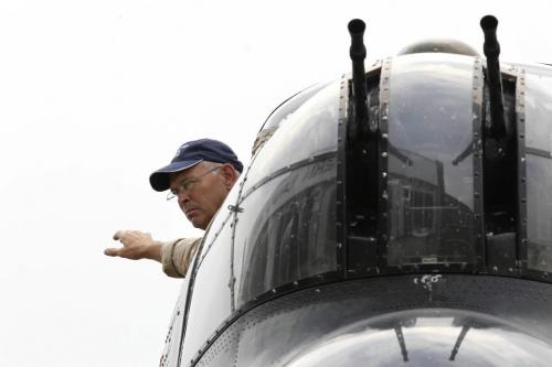 MIKE.DEAL@FREEPRESS.MB.CA 100729 - Thursday, July 29, 2010 -  The "Mynarski Memorial" Avro Lancaster Mk10 Bomber arrives at the Western Canada Aviation Museum and will be on display during the August long weekend. Member of the flight crew, Leon Evans, signals while the plane is put into position for the weekend. See Tania Kohut story MIKE DEAL / WINNIPEG FREE PRESS