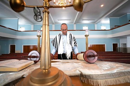 RUTH BONNEVILLE / WINNIPEG FREE PRESS

FAITH - synagogue / museum

Dr. Gerald Minuk, spreads open one of the scrolls from the Torah at the orthodox  Ashkenazie Synagogue located at 297 Burrows Ave. Monday.  

Dr. Gerald Minuk a volunteer chair of the Ashkenazies centennial committee, was involvement with turning the orthodox  Ashkenazie Synagogue located at 297 Burrows Ave  into a synagogue-museum.  

More info on this scroll.  The writing on this page of the Torah s God speaking to Moses to lead His people to freedom from the Pharaoh in Egypt. The Torah is hand-written in Hebrew with a quill on specially prepared parchment and sewn together with sinews to form one long scroll.


March 14th,  2022

