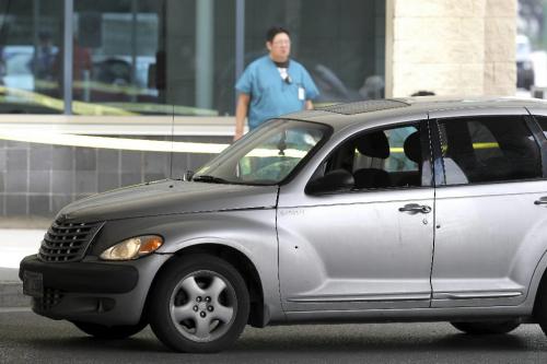 MIKE.DEAL@FREEPRESS.MB.CA 100730 - Friday, July 30, 2010 -  A PT Cruiser sits feet from the doors to the emergency entrance at the HSC with bullet holes in the driver side door. See Jen Skerritt story MIKE DEAL / WINNIPEG FREE PRESS
