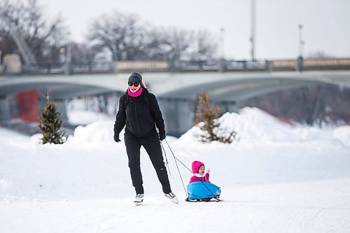 MIKAELA MACKENZIE / WINNIPEG FREE PRESS

Twila Fillion pulls her daughter, Raphaëlle Fillion (two), on an open section of the River Trail at The Forks, which is now closed from Queen Elizabeth Way to Churchill Drive, in Winnipeg on Tuesday, March 15, 2022. Standup.
Winnipeg Free Press 2022.