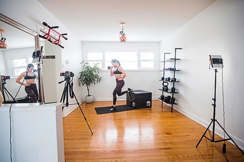 MIKAELA MACKENZIE / WINNIPEG FREE PRESS

Johanna Seier, founder of The Fit Girl Gang, demonstrates an exercise in the space where she filmed most of the workouts on the newly launched app in Winnipeg on Tuesday, March 15, 2022. For Gabby story.
Winnipeg Free Press 2022.