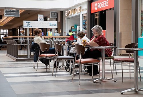 JESSICA LEE / WINNIPEG FREE PRESS
Heather Smith (right) is photographed at Polo Park March 15, 2022, the first day the mask mandates have been removed. Chairs and tables have also made their way back to the walkways in the mall.
Reporter: Chris