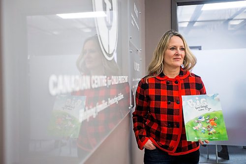 MIKAELA MACKENZIE / WINNIPEG FREE PRESS

Noni Classen, director of education for the Canadian Centre of Child Protection, poses for a portrait with a book that they've translated into Ukrainian to distribute to kids affected by the war on Tuesday, March 15, 2022. For Katie May story.
Winnipeg Free Press 2022.