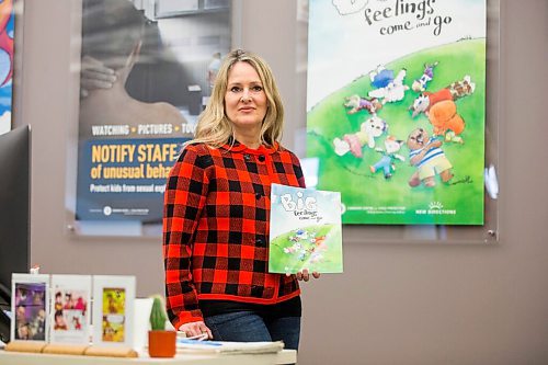 MIKAELA MACKENZIE / WINNIPEG FREE PRESS

Noni Classen, director of education for the Canadian Centre of Child Protection, poses for a portrait with a book that they've translated into Ukrainian to distribute to kids affected by the war on Tuesday, March 15, 2022. For Katie May story.
Winnipeg Free Press 2022.