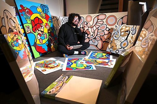 RUTH BONNEVILLE / WINNIPEG FREE PRESS

LOCAL - Blake Angeconeb

Portrait of local artist,  Blake Angeconeb, in his basement while being interviewed by a reporter surrounded by his work.  

Reader Bridge: Blake Angeconeb is an artist who paints murals and smaller works that blend Indigenous styles with pop culture. He has recently begun a partnership with IKEA and  also recently worked with Buffy Sainte-Marie.


March 16th,  2022
