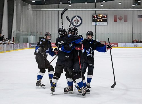 JESSICA LEE / WINNIPEG FREE PRESS

Collège Jeanne-Sauvé players celebrate after Norah Collins (4) scores the third goal. They won the womens high school hockey championship against J.H. Bruns (3-0) on March 17, 2022 during the third finals game. 

Reporter: Taylor


