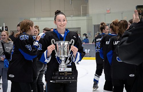 JESSICA LEE / WINNIPEG FREE PRESS

Collège Jeanne-Sauvé player Rebecca Tessmer holds the trophy following the city finals game. CJS won the womens high school hockey championship against J.H. Bruns (3-0) on March 17, 2022 during the third finals game. 

Reporter: Taylor


