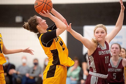 Mike Sudoma / Winnipeg Free Press
Dakota Lancers, Abby Sweeny, goes for a shot off of a rebound during The Dairy Farmers of Manitoba Provincial AAAA Girls Basketball Championship game against the Westwood Warriors at Maples Collegiate Saturday afternoon
March 19, 2022