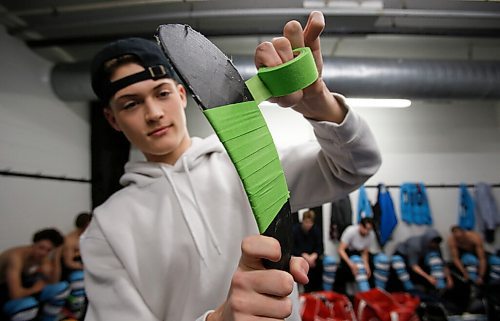 JOHN WOODS / WINNIPEG FREE PRESS
Easton Kapelus of the Lorette Scorpions, who is playing on  Winnipeg High School Hockey League (WHSHL) All-star team blue, tapes his stick in green in support of the Canadian Transplant Associations Green Shirt Day organ donor initiative in honour of the Logan Boulet Foundation at the Gateway arena in Winnipeg, Sunday, March 20, 2022.