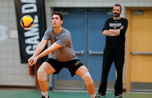 JOHN WOODS / WINNIPEG FREE PRESS
University of Manitoba Bison Owen Schwartz, as coach Arnd Ludwig looks on, during practice at the university Monday, March 21, 2022. The team will be in U Sports mens volleyball national championships this weekend.

Re: Allen