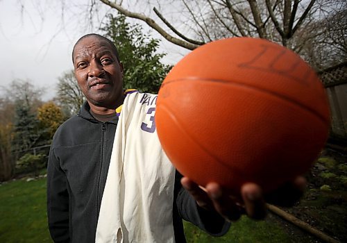 Maurice Sampson, 59, a former Gordon Bell High School Basketball Champion, photographed at his home in Surrey, BC, Wednesday, March 23, 2022. With the Jersey he wore when they won the title. (TREVOR HAGAN / WINNIPEG FREE PRESS) - for Sawatzky story