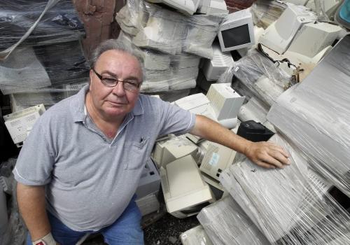 MIKE.DEAL@FREEPRESS.MB.CA 100804 - Wednesday, August 04, 2010 -  Tom Syrota, owner of Syrotech Industries, in his companies' yard piled high with electronic waste. MIKE DEAL / WINNIPEG FREE PRESS