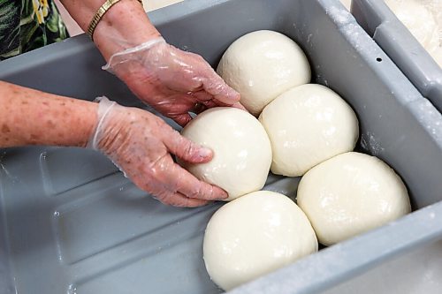 MIKE DEAL / WINNIPEG FREE PRESS
Sonjia Prociuk, shapes the dough into balls before they go into a rolling machine.
Holy Eucharist operates a year-round Perogy Hotline to raise funds for the church. Amid the crisis in Ukraine, the volunteers have started donating a portion of their proceeds to humanitarian efforts in the country.
see Eva Wasney story
220324 - Thursday, March 24, 2022.