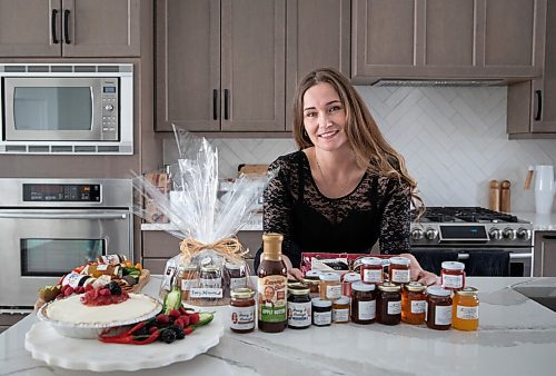 JESSICA LEE / WINNIPEG FREE PRESS

Hayley Williams, the founder of Fancy Infusions, poses for a photo on March 29, 2022 with her pepper jellies, which she sells.