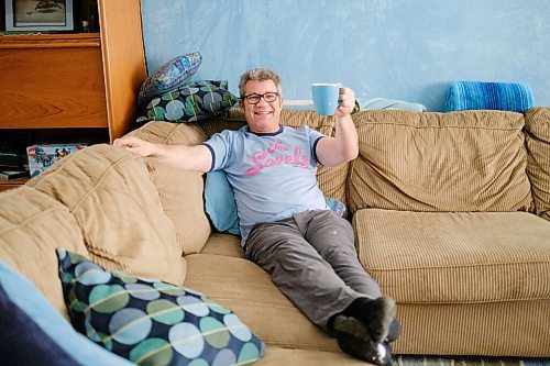 Mike Sudoma / Winnipeg Free Press
Russell Morden lounges on the couch with his coffee cup, much like he did when he and his family contracted Covid 19 after Mordens band played a show at a local venue. Both have ugly recovered.
March 30, 2022