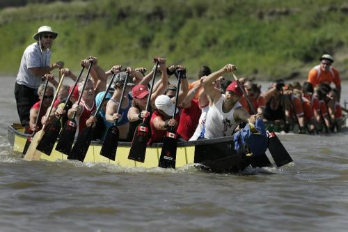 Dragon Boat Racers paddle hard in the 30 degree heat at the Canadian National Marathon Canoe Championships on the Red River at the Canoe Club in Winnipeg, Sunday, August 8, 2010.  WINNIPEG FREE PRESS/John Woods