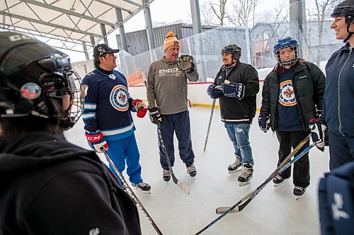 Daniel Crump / Winnipeg Free Press. Former NHLers Jason Simon (left) and Trevor Kidd (middle) talk to indigenous youth as they skate together at Camp Manitoou in Headingly. The skate is part of the Winnipeg Jets and Manitoba Moose WASAC programming. April 2, 2022.