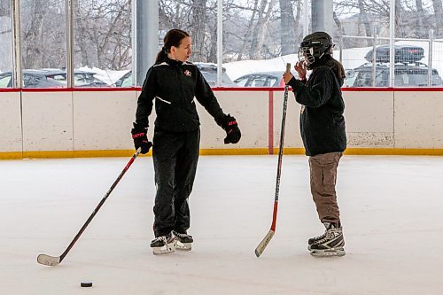 Daniel Crump / Winnipeg Free Press. Team Canada defender Jocelyne Larocque talks with Lexie Nepinak, 13, from Pine Creek First Nation as they skate at Camp Manitoou in Headingly. The skate is part of the Winnipeg Jets and Manitoba Moose WASAC programming. April 2, 2022.