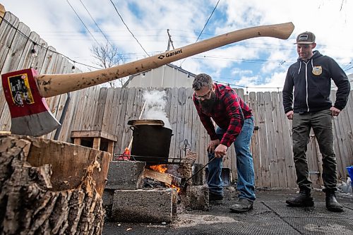 Daniel Crump / Winnipeg Free Press. Jordan Campbell (left) makes his own maple syrup in his backyard. Campbell collects the sap a Manitoba maple in his backyard and boils it down on a fire before finish the process in his kitchen. April 2, 2022.