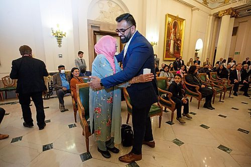 MIKE DEAL / WINNIPEG FREE PRESS
Obby Khan hugs his mother, Rehana Khan, after being sworn in as the provinces first Muslim MLA.
Obby Khan is sworn in by Patricia Chaychuk, clerk of the Legislative Assembly of Manitoba, as the newest MLA for the Manitoba PC Party, Monday morning at the Manitoba Legislative building. Having won the by-election for the Fort Whyte constituency he is the first Muslim elected to Manitoba's Assembly. 
220404 - Monday, April 04, 2022.