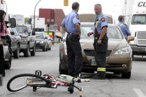 MIKE.DEAL@FREEPRESS.MB.CA 100810 - Tuesday, August 10, 2010 -  A cyclist was hit by a car on Wall Street around 9:45 am Tuesday morning. No known condition at this time. MIKE DEAL / WINNIPEG FREE PRESS