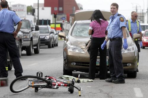 MIKE.DEAL@FREEPRESS.MB.CA 100810 - Tuesday, August 10, 2010 -  A cyclist was hit by a car on Wall Street around 9:45 am Tuesday morning. No known condition at this time. MIKE DEAL / WINNIPEG FREE PRESS