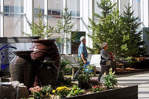 MIKE DEAL / WINNIPEG FREE PRESS
Patrons walk through the Galay Landscaping area of The Winnipeg Home and Garden Show at the RBC Convention Centre, Thursday afternoon. The show will be going from April 7-10.
220407 - Thursday, April 07, 2022.