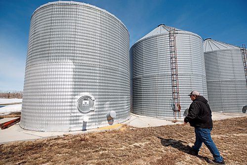 MIKE DEAL / WINNIPEG FREE PRESS
Farmer, Chuck Fossay, inspects various bins on his property about 20 miles west of Winnipeg Friday afternoon. 
Farmers are starting to plan out what to plant this year in light of all the disruptions in the market -- including the war in Ukraine -- that have driven prices up significantly in many commodities.
See Martin Cash story
220408 - Friday, April 08, 2022.