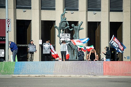 Mike Sudoma / Winnipeg Free Press
Freedom Protesters take dance and wave flags at the corner of Portage and Main Friday evening
April 8, 2022