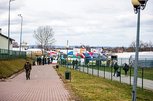 MIKAELA MACKENZIE / WINNIPEG FREE PRESS

Aid tents line the walkway to the border crossing at Medyka on Wednesday, April 6, 2022. For Melissa story.
Winnipeg Free Press 2022.