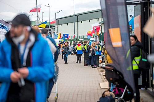 MIKAELA MACKENZIE / WINNIPEG FREE PRESS

Aid tents line the walkway to the border crossing at Medyka on Wednesday, April 6, 2022. For Melissa story.
Winnipeg Free Press 2022.