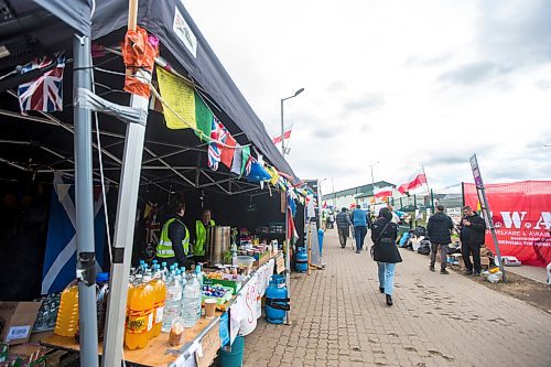 MIKAELA MACKENZIE / WINNIPEG FREE PRESS

Aid tents line the walkway to the border crossing at Medyka on Wednesday, April 6, 2022. For Melissa story.
Winnipeg Free Press 2022.