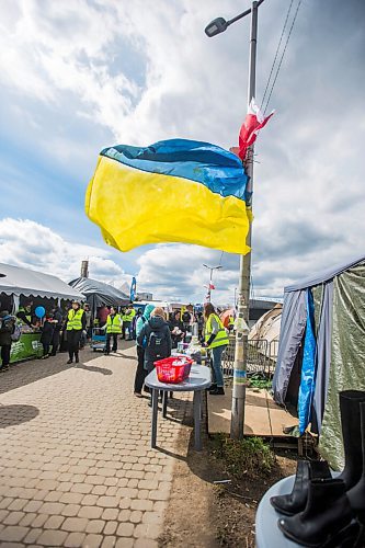 MIKAELA MACKENZIE / WINNIPEG FREE PRESS

Aid tents line the walkway to the border crossing at Medyka on Wednesday, April 6, 2022. For Melissa story.
Winnipeg Free Press 2022.