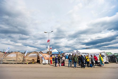 MIKAELA MACKENZIE / WINNIPEG FREE PRESS

Aid tents line the walkway to the border crossing at Medyka on Wednesday, April 6, 2022. For Melissa story.
Winnipeg Free Press 2022.