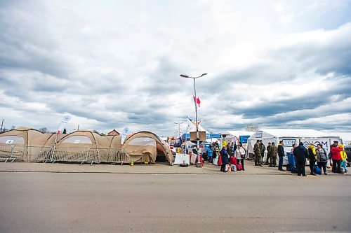 MIKAELA MACKENZIE / WINNIPEG FREE PRESS

Aid tents line the walkway to the border crossing at Medyka on Wednesday, April 6, 2022. For Melissa story.
Winnipeg Free Press 2022.