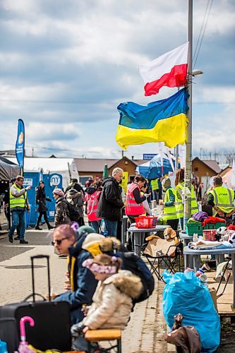 MIKAELA MACKENZIE / WINNIPEG FREE PRESS

Aid tents line the walkway to the border crossing at Medyka on Wednesday, April 6, 2022. For Melissa story.
Winnipeg Free Press 2022.