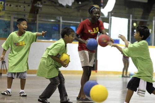 MIKE.DEAL@FREEPRESS.MB.CA 100812 - Thursday, August 12, 2010 -  Grace Fanhbulleh, 15, a student in the Model School at the University of Winnipeg takes part in the community outreach initiative with younger kids in the Eco-Kids program playing dodge ball at the Sargent Park Arena. MIKE DEAL / WINNIPEG FREE PRESS