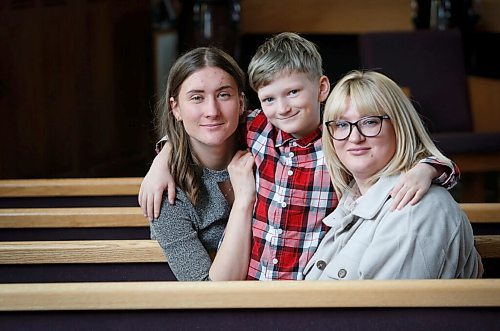 JOHN WOODS / WINNIPEG FREE PRESS
Alina Roshko and her son Dima, 9, and her sister Valerie Alipova, left, are photographed at Bethel Mennonite Church Sunday, April 10, 2022. Roshko came to Canada with her two children and is staying with her sisters family while her husband remains in Ukraine to fight.