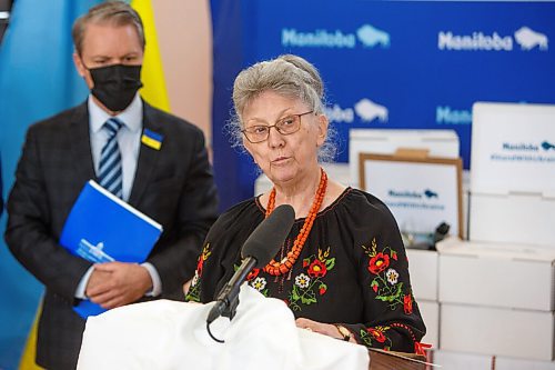 MIKE DEAL / WINNIPEG FREE PRESS
Joanne Lewandosky, president of the Ukrainian Canadian Congress speaks during Finance Minister Cameron Friesen's traditional Budget 2022 shoe announcement where he is handing her a box of essential personal hygiene items as a symbolic gesture, at 935 Main Street, Ukrainian National Federation of Canada, Monday morning.
220411 - Monday, April 11, 2022.