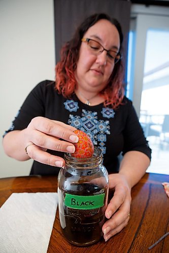 MIKE DEAL / WINNIPEG FREE PRESS
Tracy puts a pysanka in a jar of black dye, the final layer of dye that is used.
Tracy Rossier has been making and selling Ukrainian pysanky eggs for years; her Instagram bio puts it succinctly, "Manitoba Ukrainian egg artist. Saving the world one pysanka at a time."
See Dave Sanderson story
220408 - Friday, April 08, 2022.