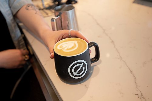 Mike Sudoma / Winnipeg Free Press
Barista Emily Green serves up a Vanilla Latte, one of Empty Cups most popular beverages Tuesday
April 12, 2022