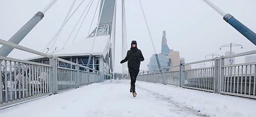 RUTH BONNEVILLE / WINNIPEG FREE PRESS

Weather Standup

Avid runner, Blair Kroeker, makes his way across the Esplanade Riel pedestrian bridge amidst blowing snow    Thursday afternoon.  He runs about  5 - 10k a day and  says he enjoys being out in this weather when no one else is out. 
 
April 14h,  2022
