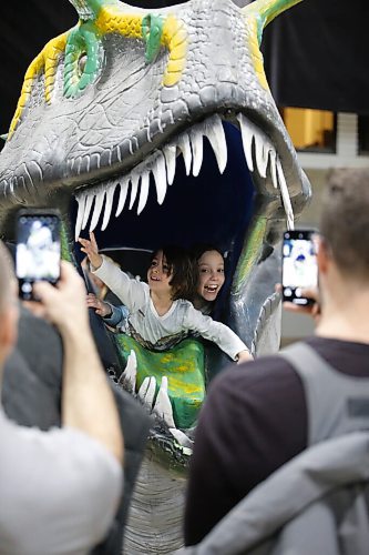 JOHN WOODS / WINNIPEG FREE PRESS
Thomas Renzelli, left, and Isabella Krstic pop out of a dinosaur head as their dads Frank Renzelli and Alek Krstic photograph them during Jurassic Quest at the Convention Centre Friday, April 15, 2022. 


Re: searle